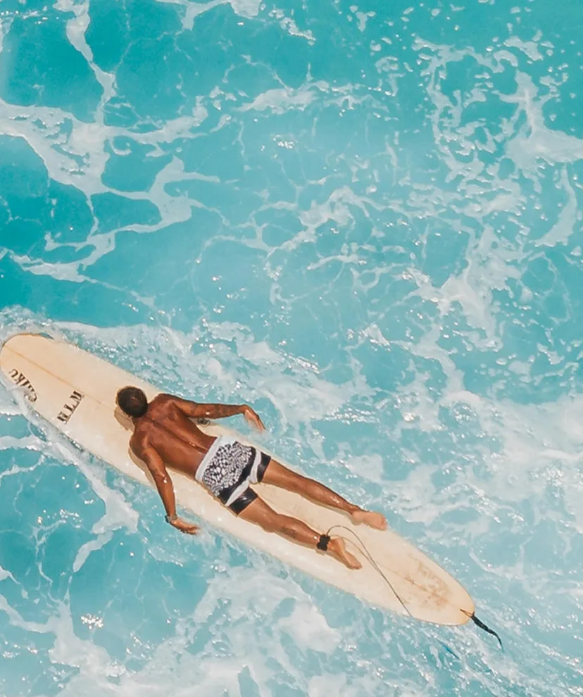 Person floating in pool representing relaxation